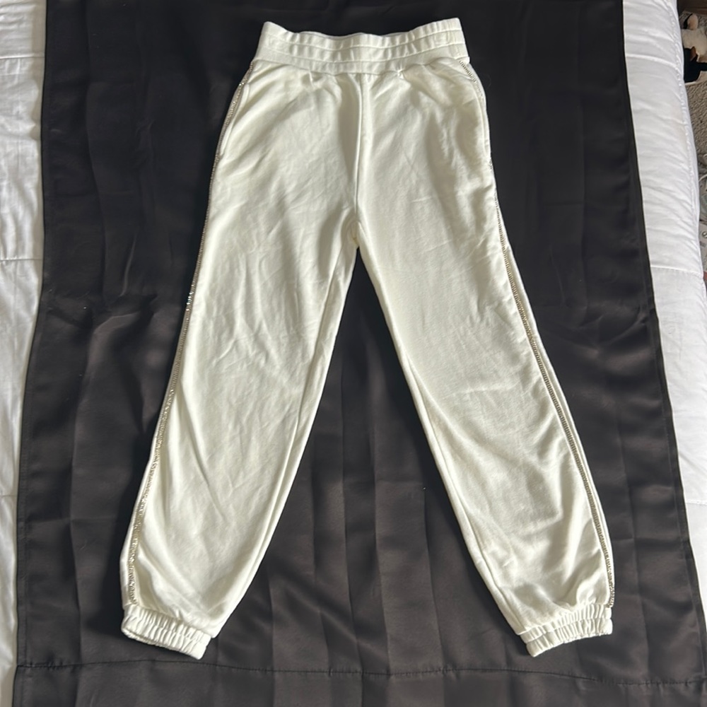 Off white jogger sweats, diamond embroidered on sides.